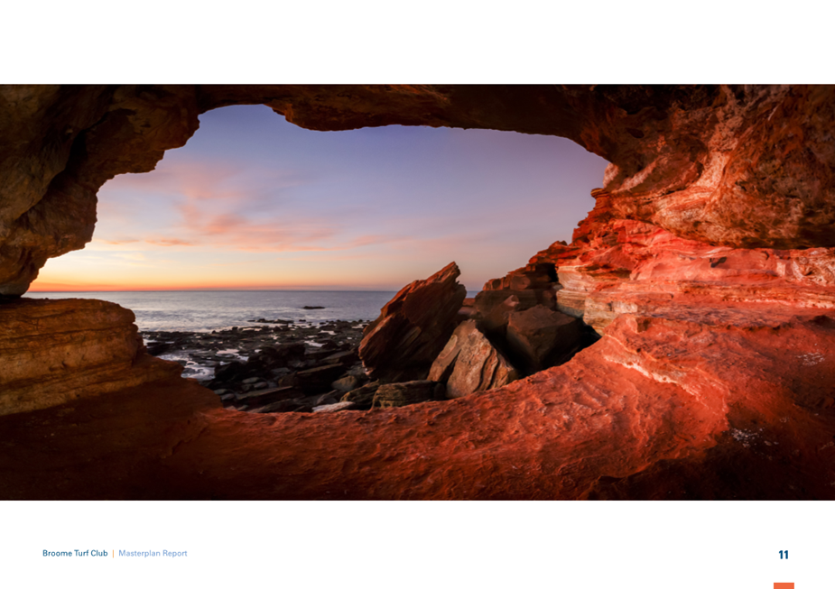 A rock formation with a hole in the middle

Description automatically generated