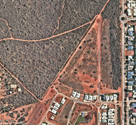An aerial view of a town

AI-generated content may be incorrect.